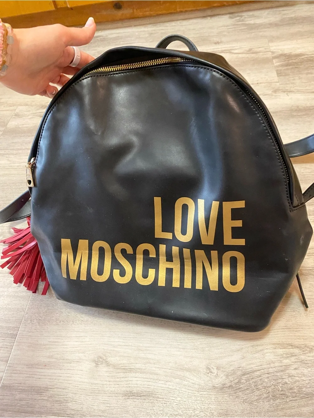 Love Moschino Black Backpack with Gold Logo and Red Tassel